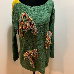 Statement green sweater with fringe design